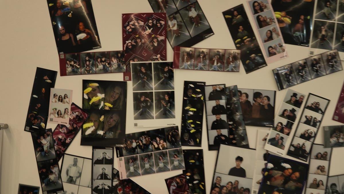The wall at PhotoDA Stuttgart covered in real printed photo strips